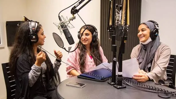 Students recording a podcast