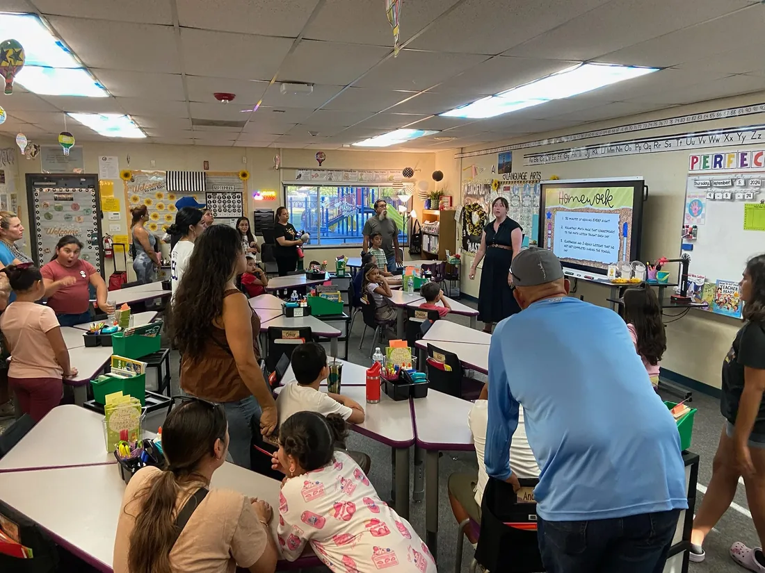 Parents watching a showcase evening in a classroom